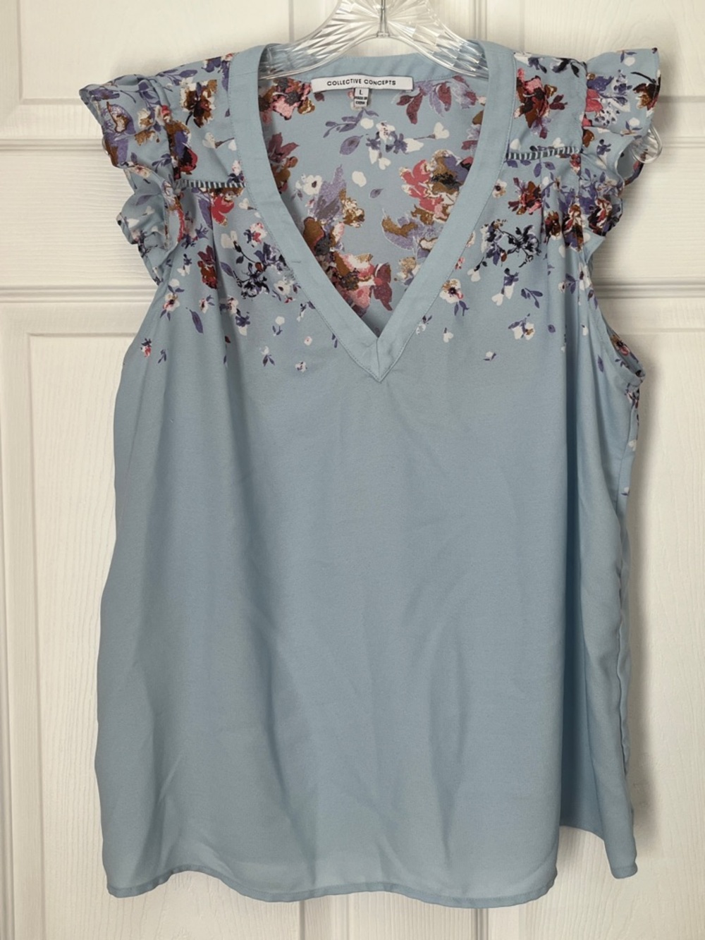 Collective Concepts Women's LV-Neck Sleeveless Blue Floral Ruffle
Blouse